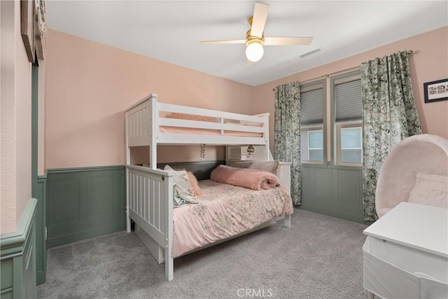 920 Bunkhouse Dr, Rancho Mission Viejo, CA 92694 - bedroom with carpet, a wainscoted wall, a ceiling fan, and a decorative wall