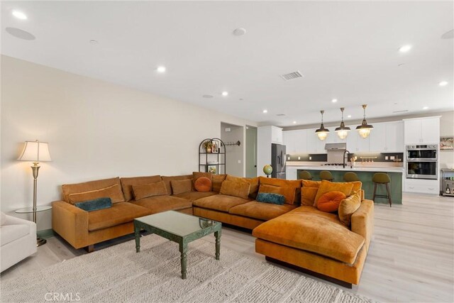 920 Bunkhouse Dr, Rancho Mission Viejo, CA 92694 - living room with light wood-type flooring and recessed lighting