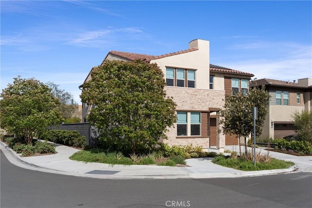 920 Bunkhouse Dr, Rancho Mission Viejo, CA 92694 - view of property featuring stone siding, stucco siding, and a tiled roof