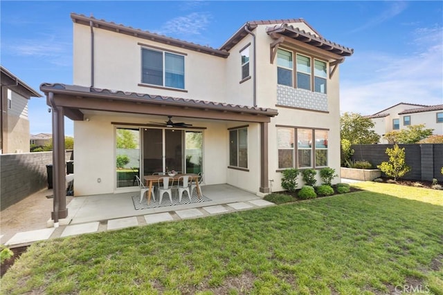 920 Bunkhouse Dr, Rancho Mission Viejo, CA 92694 - back of house featuring ceiling fan, stucco siding, a patio area, and a tile roof