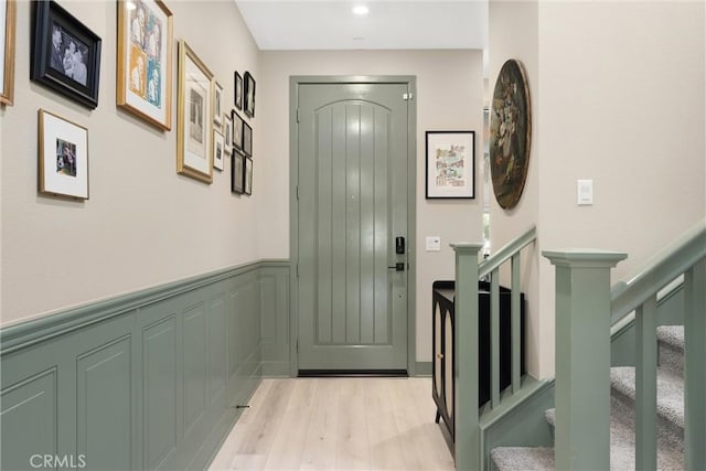 920 Bunkhouse Dr, Rancho Mission Viejo, CA 92694 - entryway with light wood finished floors, wainscoting, stairs, and recessed lighting