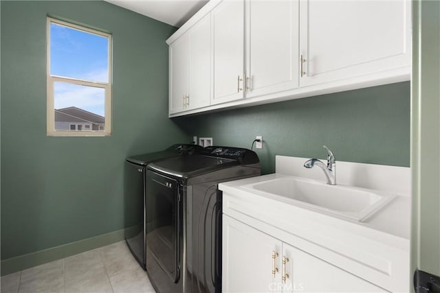 920 Bunkhouse Dr, Rancho Mission Viejo, CA 92694 - laundry room featuring washer and clothes dryer, cabinet space, and light tile patterned floors