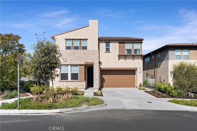 920 Bunkhouse Dr, Rancho Mission Viejo, CA 92694 - view of front of house with an attached garage, stucco siding, concrete driveway, and a tile roof