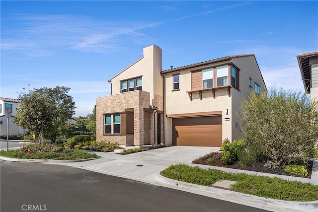 920 Bunkhouse Dr, Rancho Mission Viejo, CA 92694 - view of front of home featuring a garage, concrete driveway, and stucco siding
