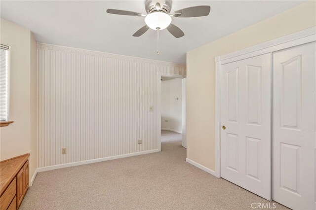 50711 Rd 426, Oakhurst, CA 93644 - unfurnished bedroom with light carpet, baseboards, a closet, and ceiling fan