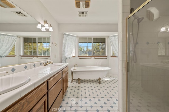 50711 Rd 426, Oakhurst, CA 93644 - bathroom with double vanity, a shower stall, a soaking tub, and healthy amount of natural light