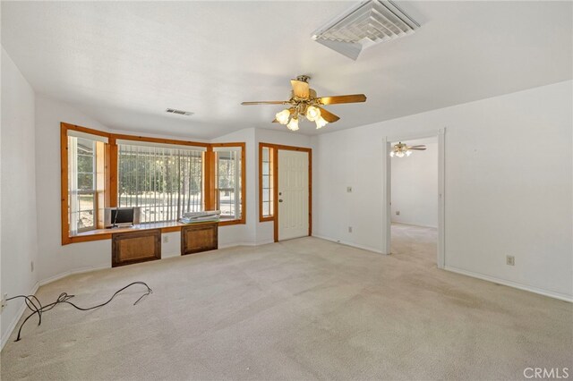 50711 Rd 426, Oakhurst, CA 93644 - unfurnished living room featuring light carpet, baseboards, and ceiling fan