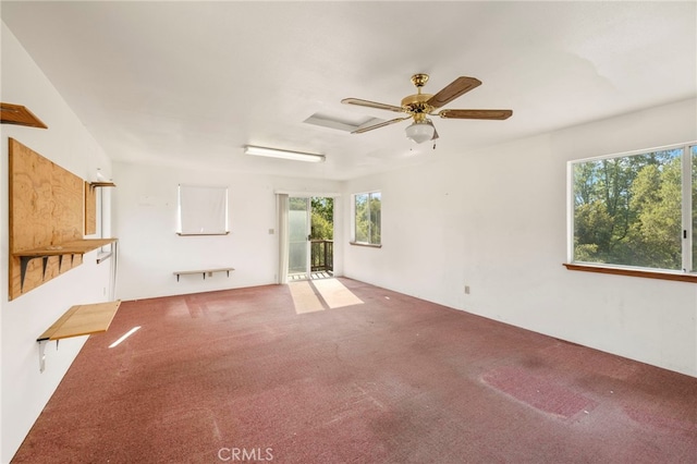 50711 Rd 426, Oakhurst, CA 93644 - unfurnished living room featuring healthy amount of natural light, carpet floors, and a ceiling fan