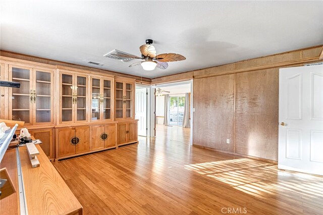 50711 Rd 426, Oakhurst, CA 93644 - spare room featuring a ceiling fan, light wood-type flooring, and wooden walls