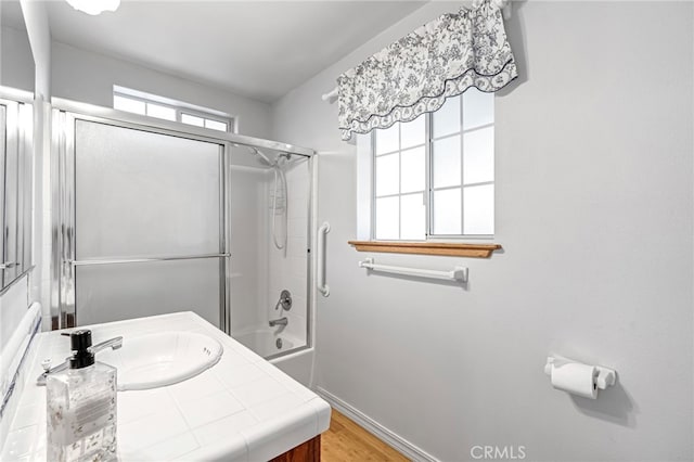 50711 Rd 426, Oakhurst, CA 93644 - bathroom featuring vanity, combined bath / shower with glass door, and wood finished floors