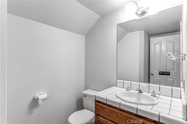 50711 Rd 426, Oakhurst, CA 93644 - bathroom featuring lofted ceiling and vanity