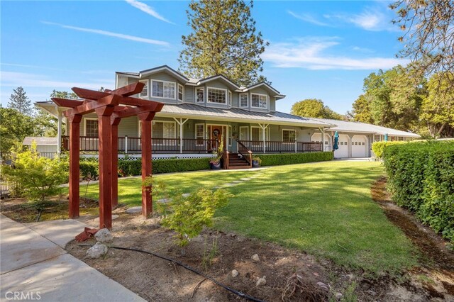 50711 Rd 426, Oakhurst, CA 93644 - view of front facade with a porch, an attached garage, a front lawn, and a metal roof