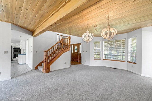 50711 Rd 426, Oakhurst, CA 93644 - unfurnished living room with a chandelier, carpet, stairs, and a wood ceiling with exposed beams