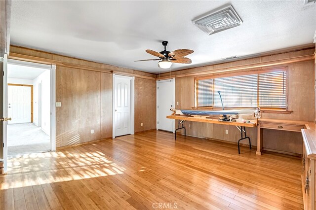 50711 Rd 426, Oakhurst, CA 93644 - unfurnished office with light wood finished floors, ceiling fan, and wood walls
