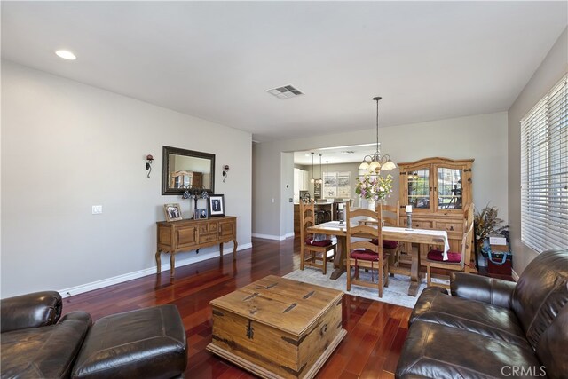 28759 Eridanus Dr, Menifee, CA 92586 - living room with dark wood-type flooring, a chandelier, baseboards, and recessed lighting
