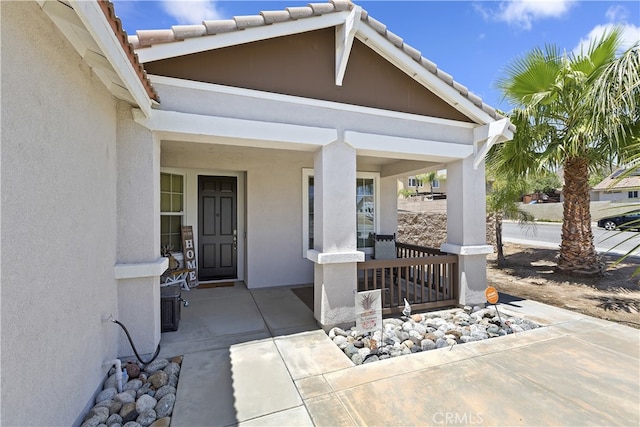 28759 Eridanus Dr, Menifee, CA 92586 - doorway to property featuring a porch and stucco siding