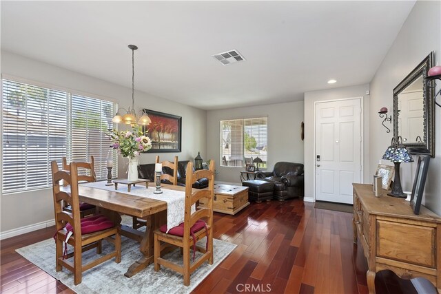 28759 Eridanus Dr, Menifee, CA 92586 - dining area featuring dark wood finished floors, a chandelier, recessed lighting, and baseboards