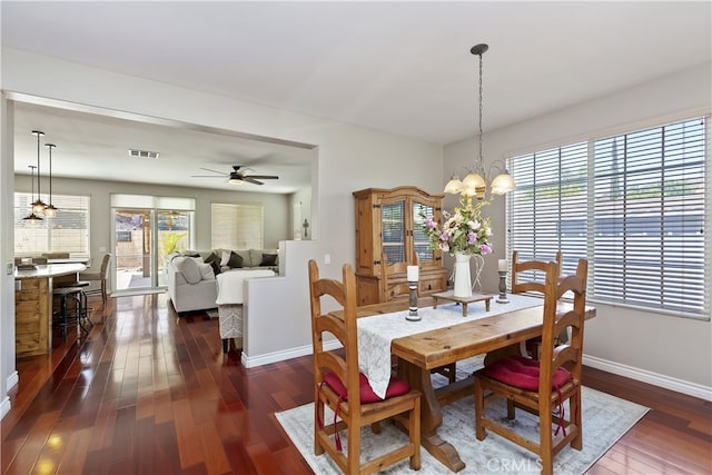 28759 Eridanus Dr, Menifee, CA 92586 - dining space with dark wood-style floors, plenty of natural light, and baseboards