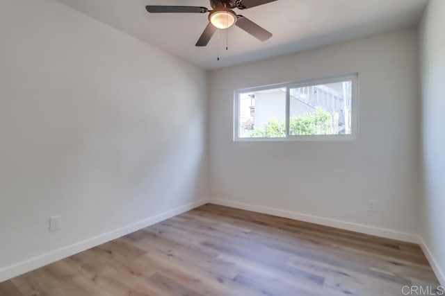 1215 Grand Ave, Spring Valley, CA 91977 - unfurnished room featuring baseboards, light wood-style floors, and a ceiling fan