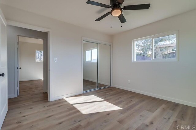 1215 Grand Ave, Spring Valley, CA 91977 - unfurnished bedroom featuring light wood-style floors, baseboards, and a closet