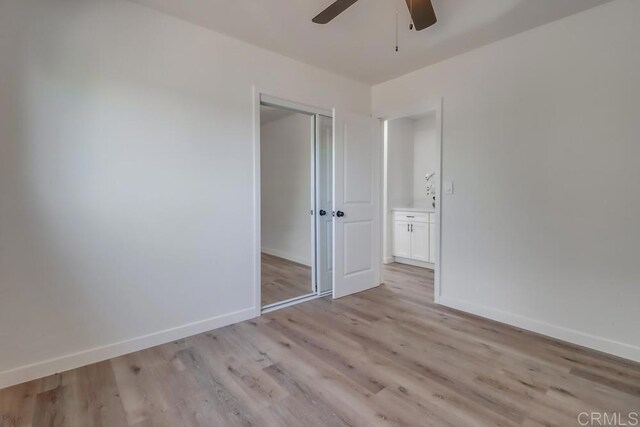 1215 Grand Ave, Spring Valley, CA 91977 - unfurnished bedroom featuring light wood-style floors, a closet, baseboards, and ceiling fan