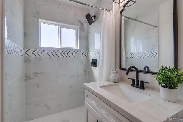 1215 Grand Ave, Spring Valley, CA 91977 - full bathroom with vanity and a marble finish shower