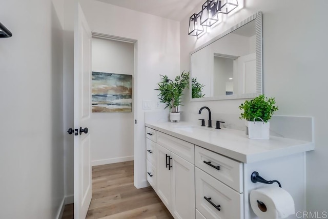 1215 Grand Ave, Spring Valley, CA 91977 - bathroom with vanity, wood finished floors, and baseboards