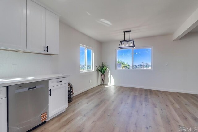 1215 Grand Ave, Spring Valley, CA 91977 - unfurnished dining area featuring light wood-style floors and baseboards