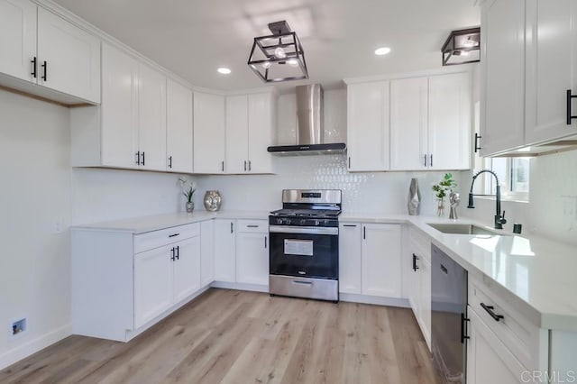 1215 Grand Ave, Spring Valley, CA 91977 - kitchen featuring gas range, wall chimney range hood, a sink, dishwasher, and light wood-type flooring