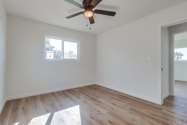 1215 Grand Ave, Spring Valley, CA 91977 - spare room featuring light wood-style flooring, healthy amount of natural light, and baseboards