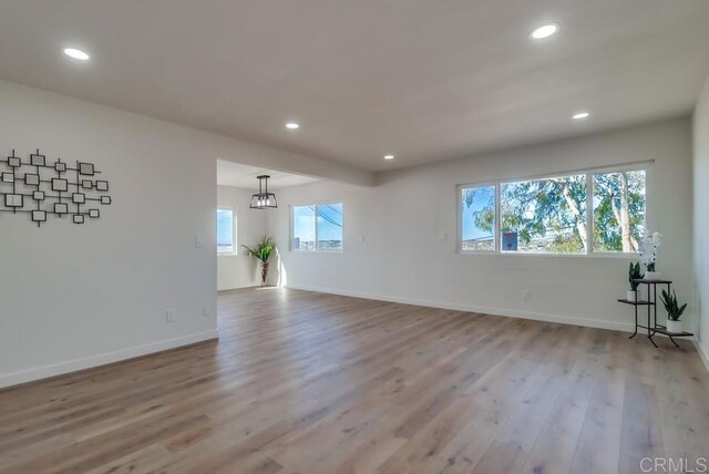 1215 Grand Ave, Spring Valley, CA 91977 - spare room featuring wood finished floors, recessed lighting, and baseboards