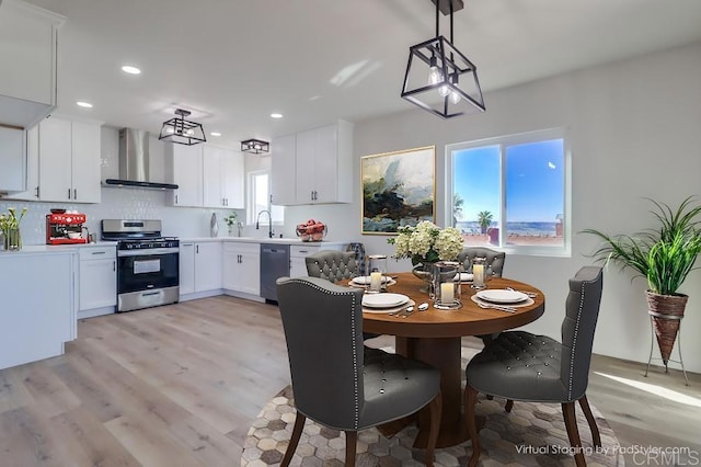 1215 Grand Ave, Spring Valley, CA 91977 - dining space with healthy amount of natural light, light wood finished floors, and recessed lighting