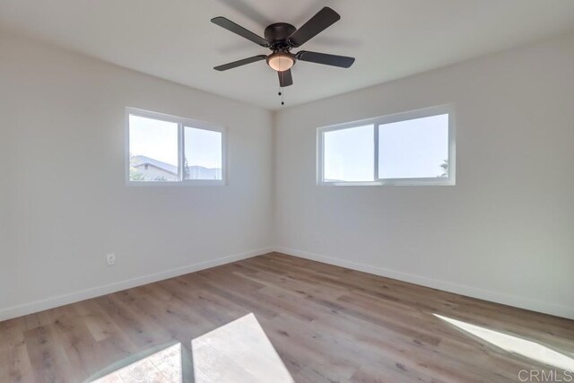 1215 Grand Ave, Spring Valley, CA 91977 - spare room with baseboards, light wood-style floors, and ceiling fan