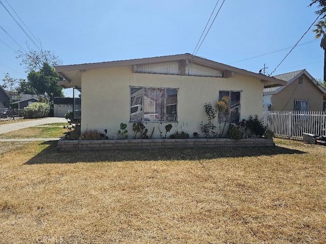 6704 Vinevale Ave, Bell, CA 90201 - view of side of home with stucco siding