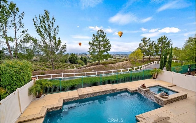 31193 Skyline Dr, Temecula, CA 92591 - view of swimming pool featuring a fenced backyard, a patio, and a pool with connected hot tub