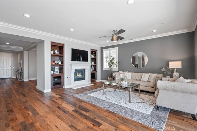 31193 Skyline Dr, Temecula, CA 92591 - living area featuring recessed lighting, baseboards, ceiling fan, a glass covered fireplace, and wood finished floors