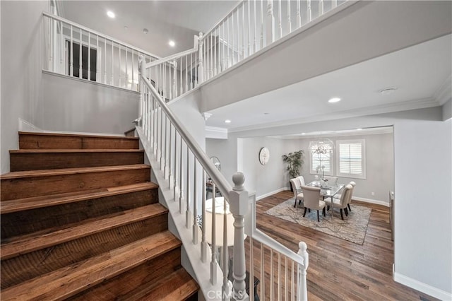 31193 Skyline Dr, Temecula, CA 92591 - staircase featuring baseboards, crown molding, wood finished floors, and recessed lighting