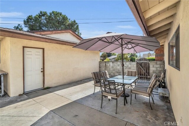 1487 Asbury Dr, Pasadena, CA 91104 - view of patio with outdoor dining space, a gate, and fence
