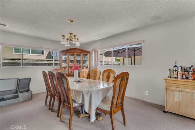 1487 Asbury Dr, Pasadena, CA 91104 - dining space with a chandelier, carpet floors, and a textured ceiling