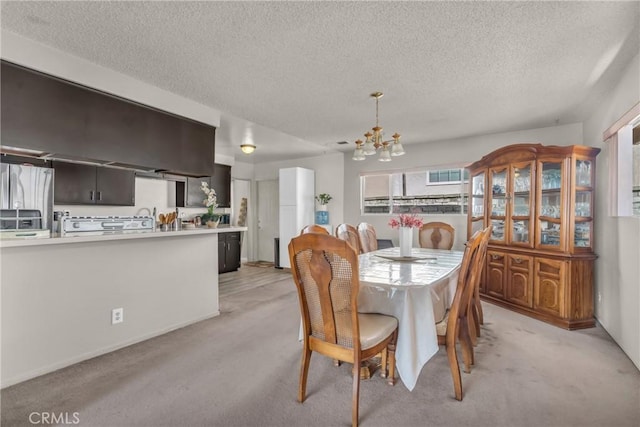 1487 Asbury Dr, Pasadena, CA 91104 - dining room featuring a chandelier, light carpet, and a textured ceiling