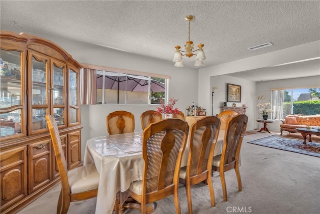 1487 Asbury Dr, Pasadena, CA 91104 - dining space with light carpet, a chandelier, and a textured ceiling