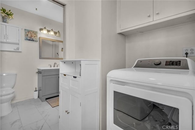 1487 Asbury Dr, Pasadena, CA 91104 - washroom with washer / dryer, light marble finish floors, and baseboards