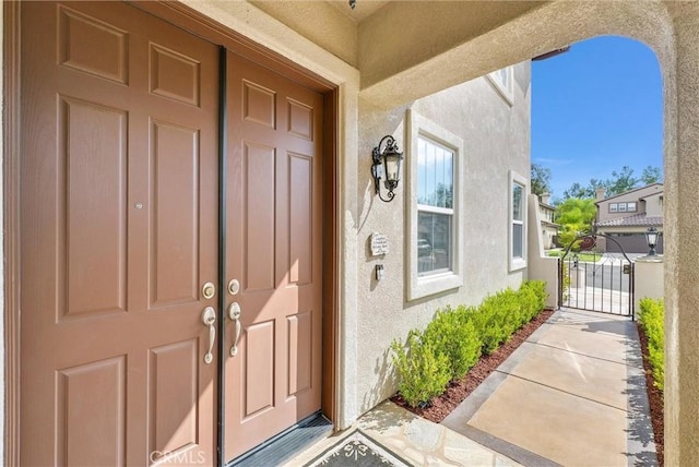 43376 Terra Ct, Temecula, CA 92592 - view of exterior entry with stucco siding and a gate