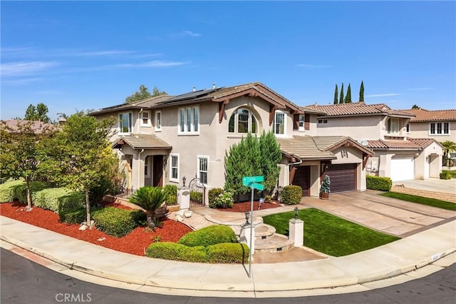 43376 Terra Ct, Temecula, CA 92592 - view of front of house with driveway, roof mounted solar panels, stucco siding, and a garage