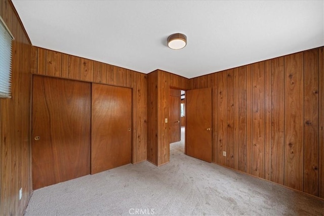951 Snowbird Rd, Wrightwood, CA 92397 - unfurnished bedroom with a closet, wood walls, and carpet flooring