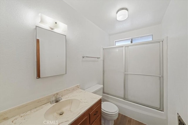 951 Snowbird Rd, Wrightwood, CA 92397 - full bathroom with toilet, vanity, shower / bath combination with glass door, and wood finished floors