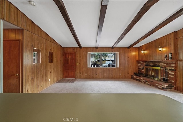 951 Snowbird Rd, Wrightwood, CA 92397 - unfurnished living room with carpet, wood walls, and a brick fireplace