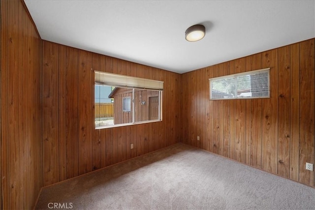 951 Snowbird Rd, Wrightwood, CA 92397 - unfurnished room with healthy amount of natural light, carpet floors, and wood walls