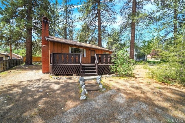 951 Snowbird Rd, Wrightwood, CA 92397 - rustic home with a chimney and a wooden deck