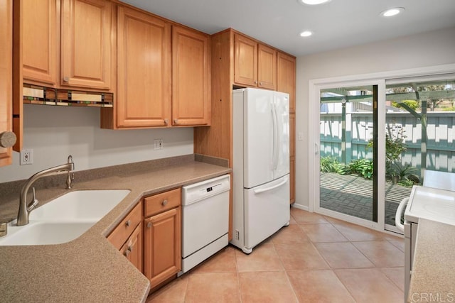 kitchen with white appliances, a sink, recessed lighting, and light tile patterned floors